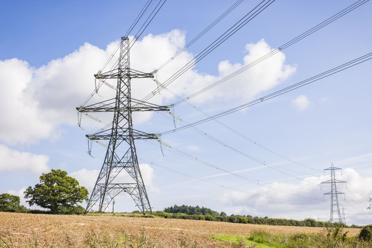 Electricity pylons in UK countryside, rural landscape